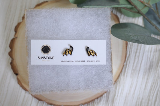 Black and gold dinosaur earrings with stainless steel posts