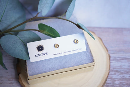 Handcrafted gold circle stud earrings in 6mm displayed on Sunstone Clay Co card.