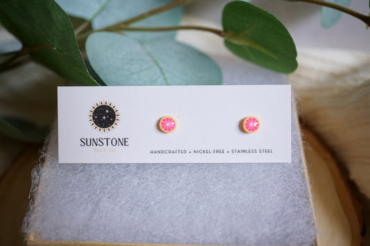 Everyday minis grapefruit stud earrings displayed on jewelry card