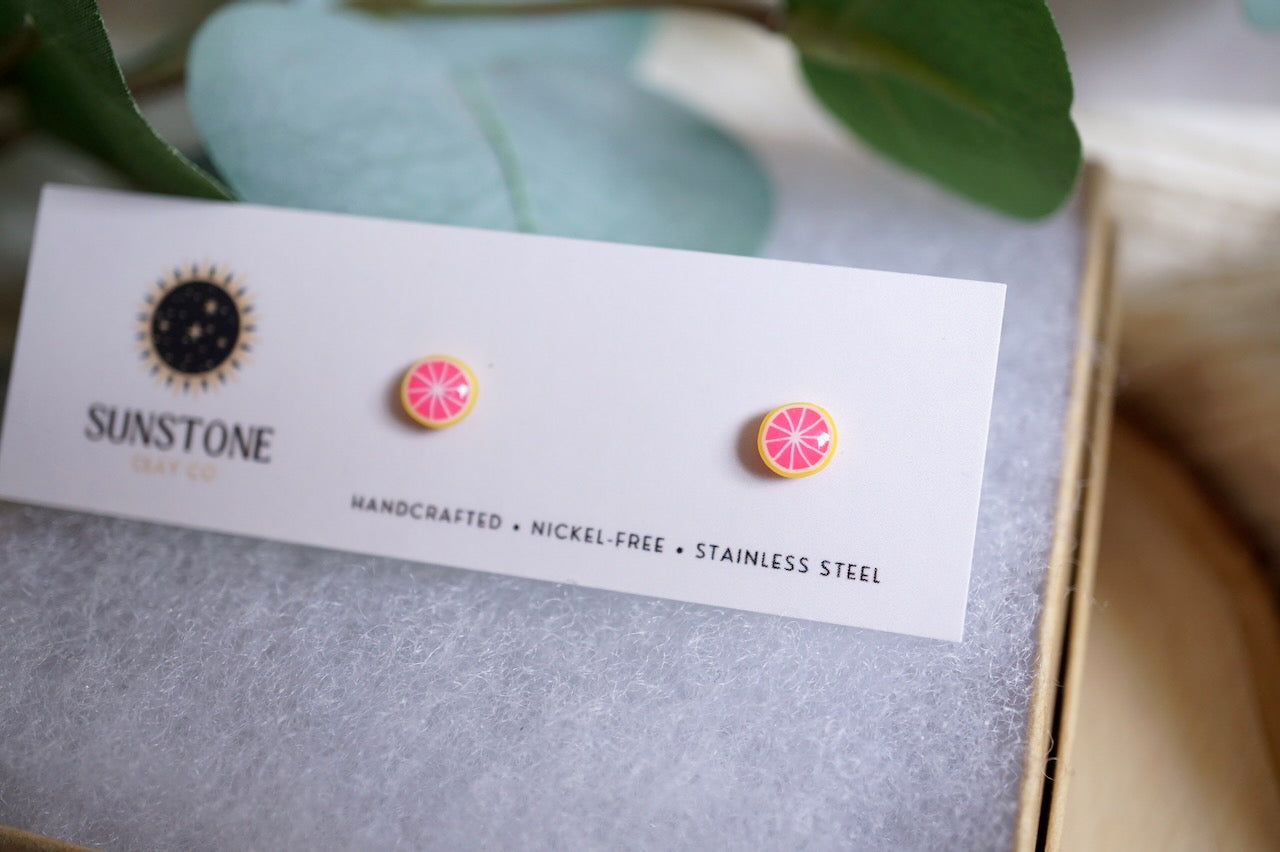 Everyday minis grapefruit stud earrings displayed on jewelry card