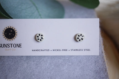 Handcrafted soursop slice stud earrings on Sunstone Clay Co display card