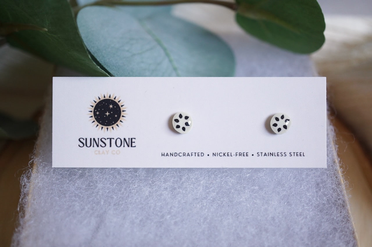 Handcrafted soursop slice stud earrings on Sunstone Clay Co display card