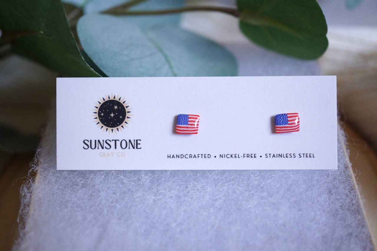 Patriotic polymer clay stud earrings in red, white, and blue American flag design