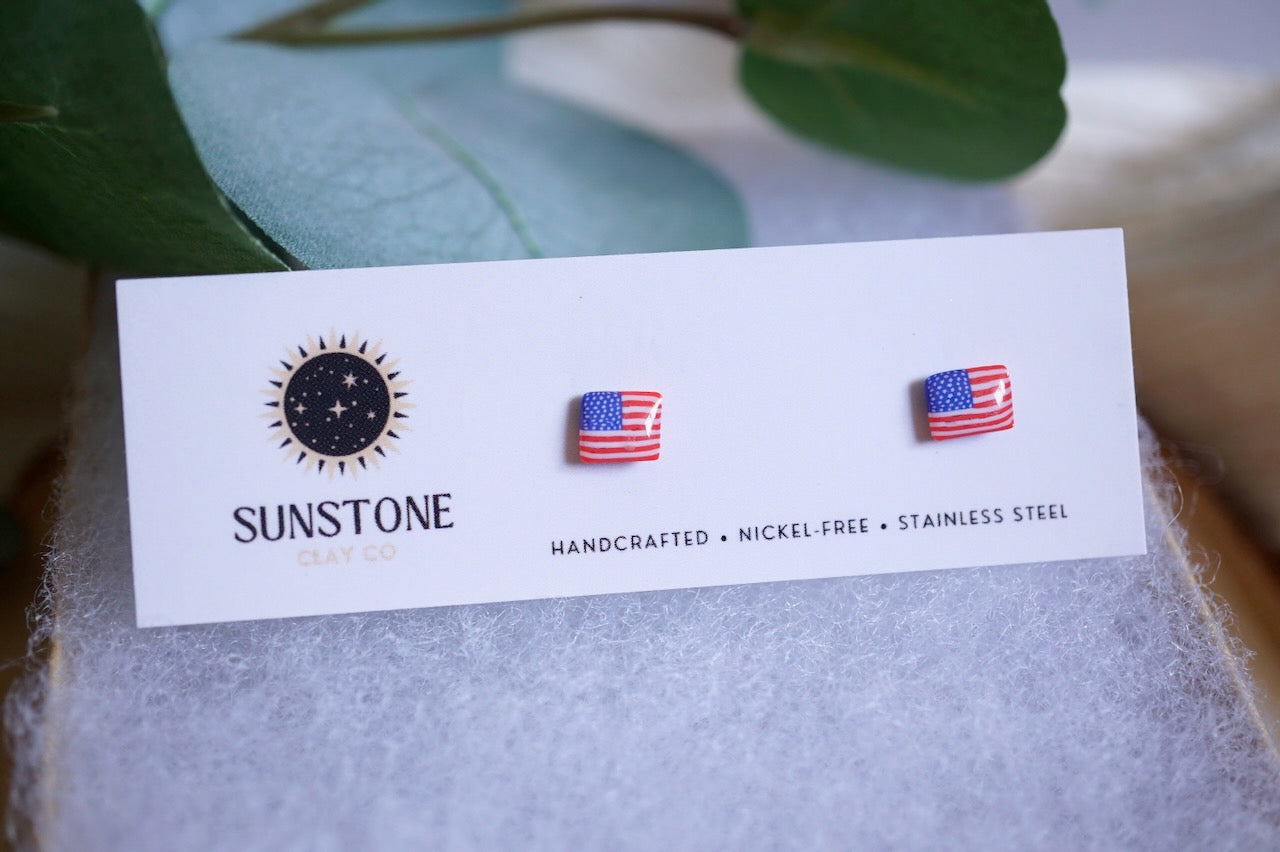 Patriotic polymer clay stud earrings in red, white, and blue American flag design