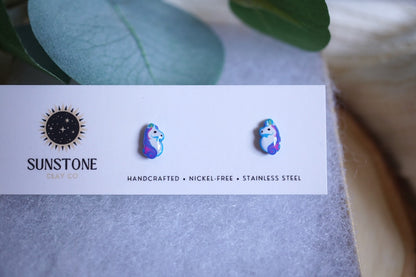 Earring card with 'Sunstone' branding and two colorful unicorn earrings on an earring card.