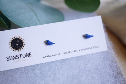 Miniature blue bird polymer clay studs on jewelry display card