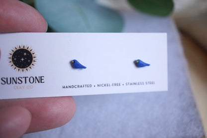 Miniature blue bird polymer clay studs on jewelry display card