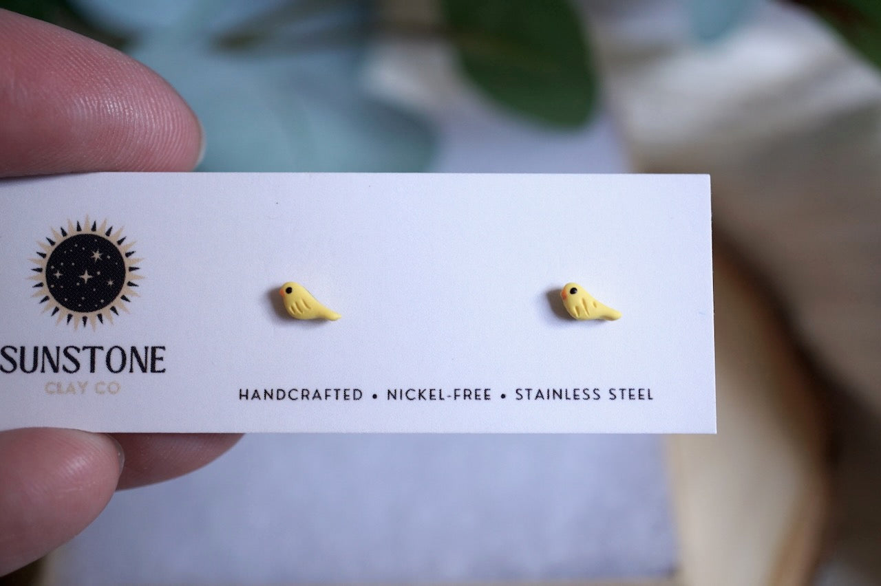 Tiny yellow bird stud earrings with stainless steel posts