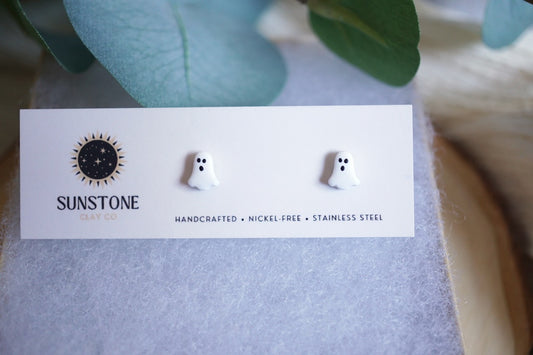 Ghost-shaped earrings on a Sunstone branded card with a light background