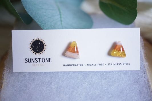 Polymer clay candy corn earrings with translucent amber and white gradient