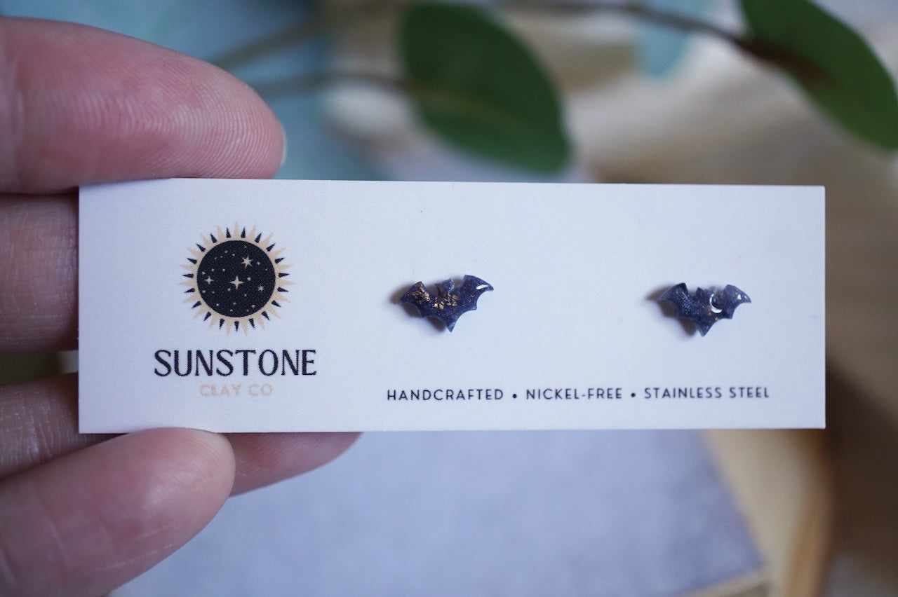 A card with mini bat earrings and Sunstone branding