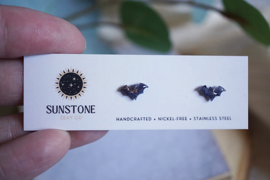 A card with mini bat earrings and Sunstone branding