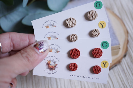 Handcrafted knitted texture stud earrings in large and small, and in beige and red options.