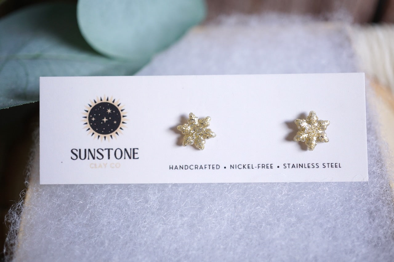 Handcrafted glittery snowflake stud earrings in gold