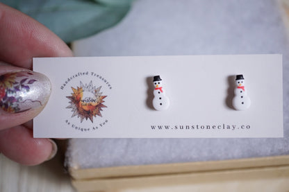 Handcrafted snowman stud earrings with black hats and red scarves