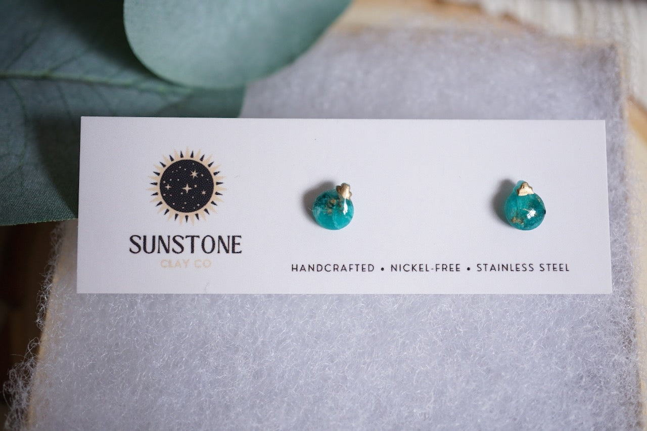 Small handcrafted ornament earrings in green.