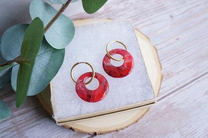 Handmade circle crimson earrings with marbled stone effect on gold hoops