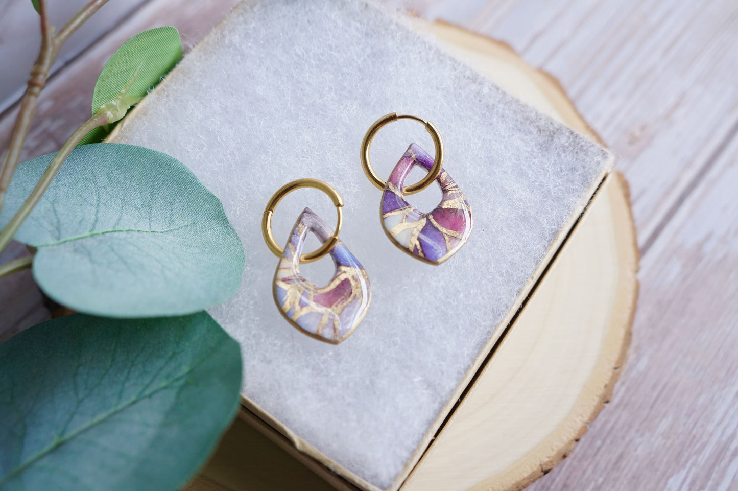 Handmade floral-inspired earrings with gold veining