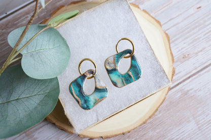 Lightweight polymer clay dangle earrings with marbled teal design